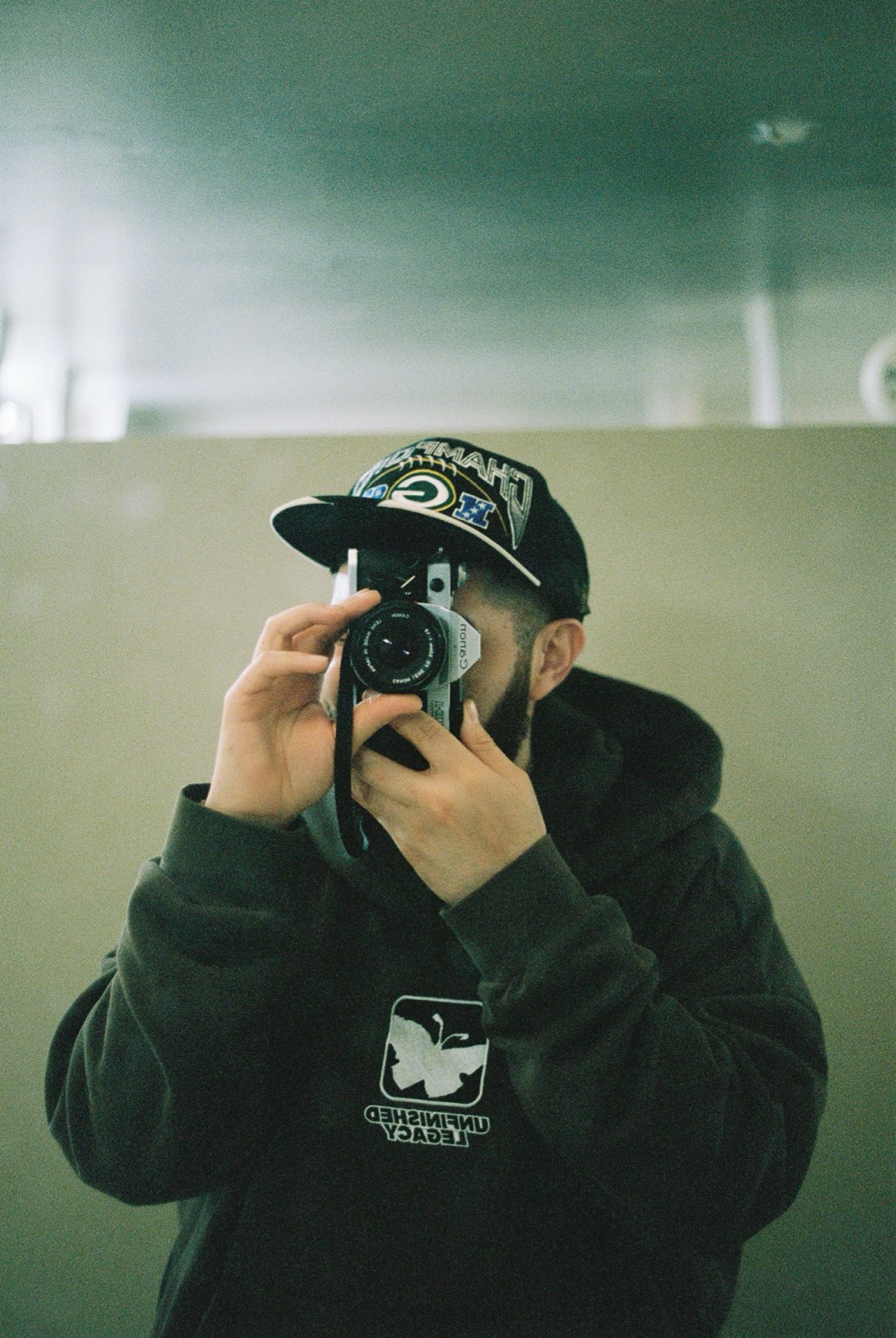 Com, self-portrait with camera